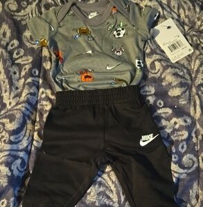 Nike Baby Outfit with Graphic Onesie and Black Pants
